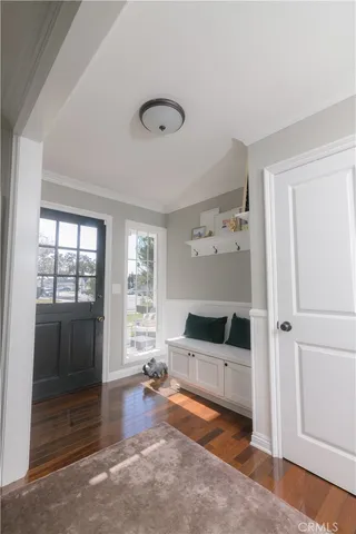a living room with a fireplace furniture and a window