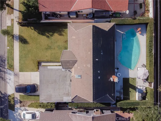 an aerial view of houses with outdoor space