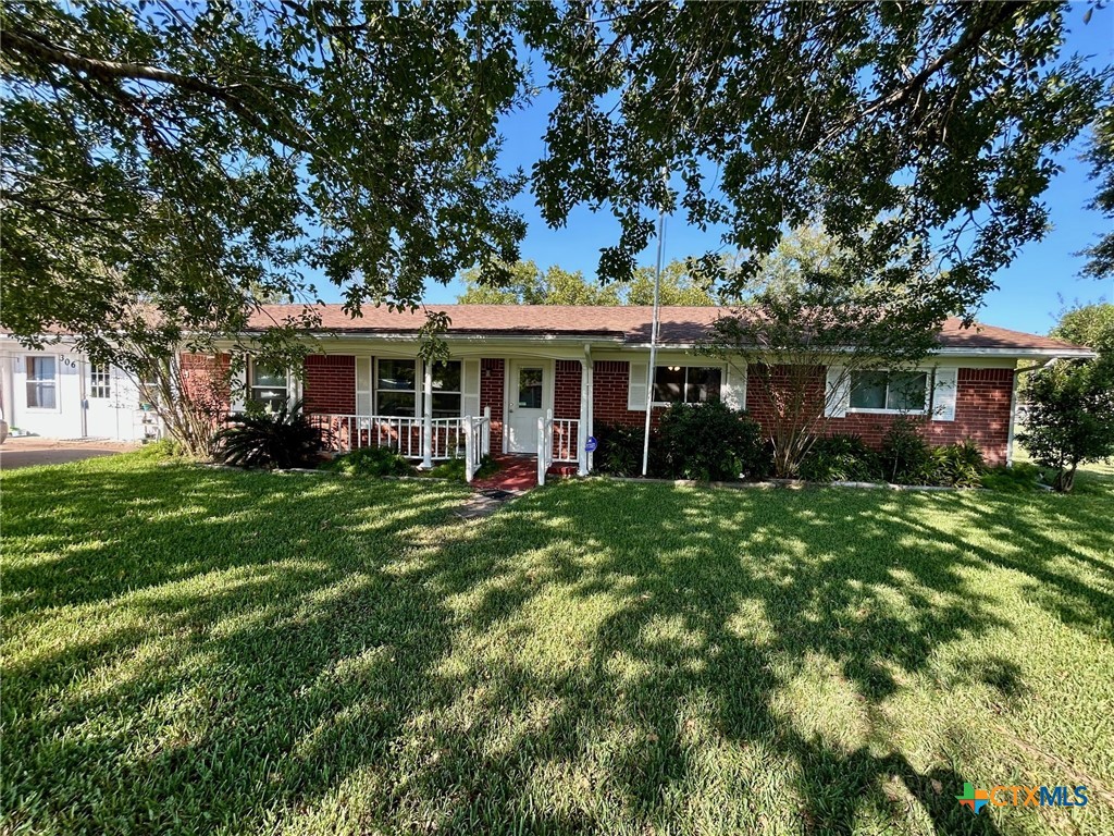 306 Dover Street Victoria, TX 77905 - Photo 2 of 20 a view of a house with a backyard