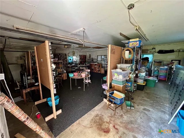 a living room with lots of furniture and white walls