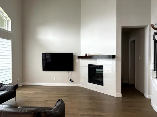 a living room with a flat screen tv and a fireplace