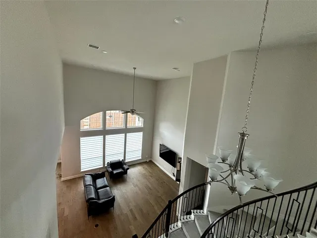 a view of a livingroom with furniture and hardwood floor