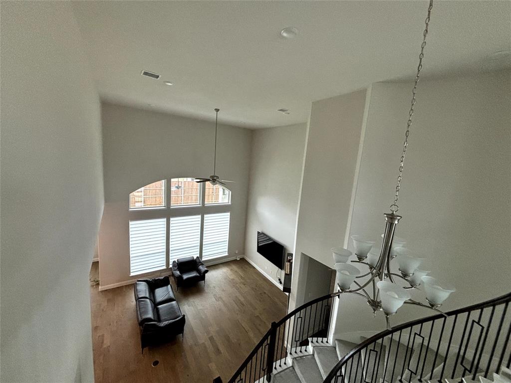 13391 Empire Maker Road Frisco, TX 75035 - Photo 4 of 12 a view of a livingroom with furniture and hardwood floor