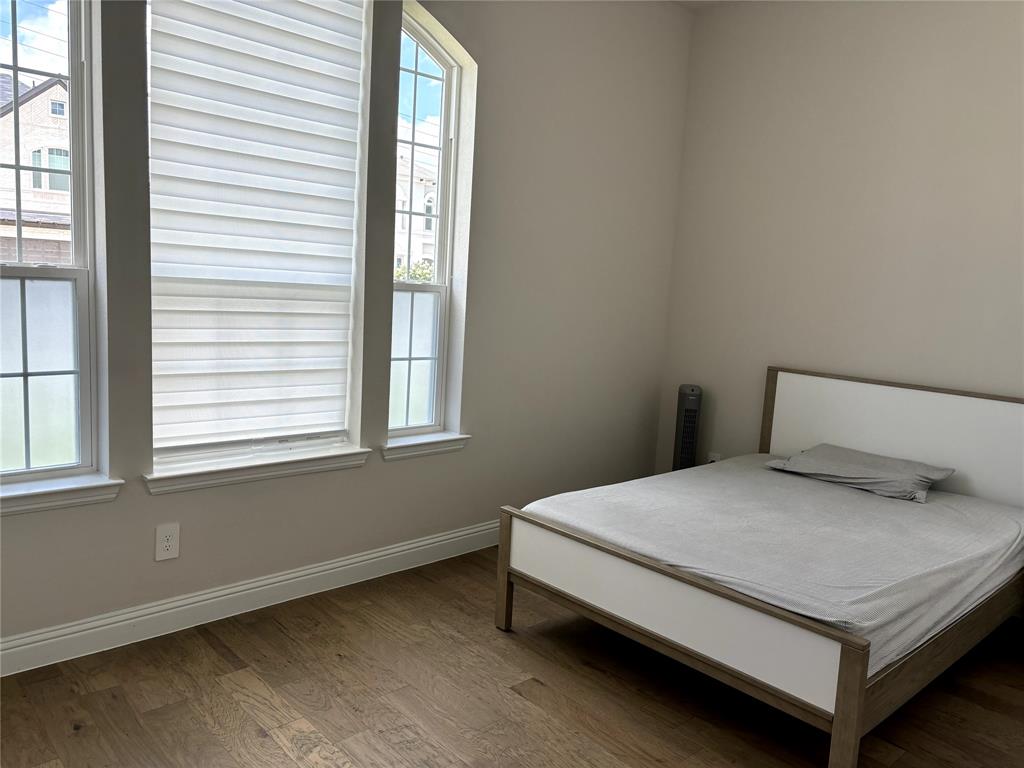 13391 Empire Maker Road Frisco, TX 75035 - Photo 7 of 12 a bedroom with a bed and window