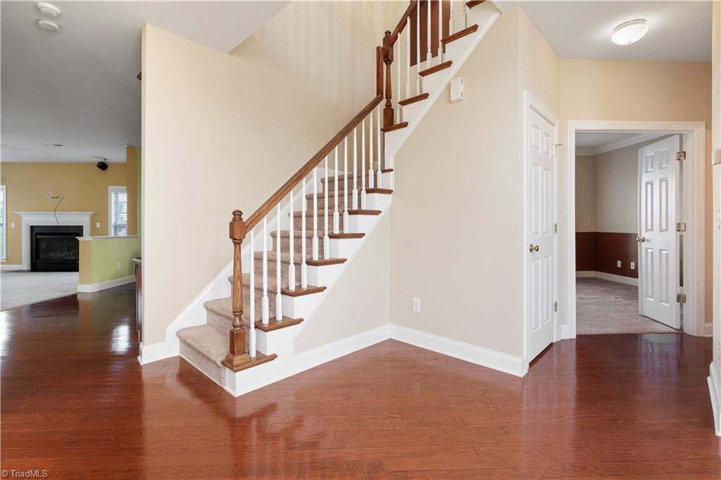 4485 Alderny Circle High Point, NC 27265 - Photo 7 of 38 Stairwell, coat closet, and office/playroom entrance
