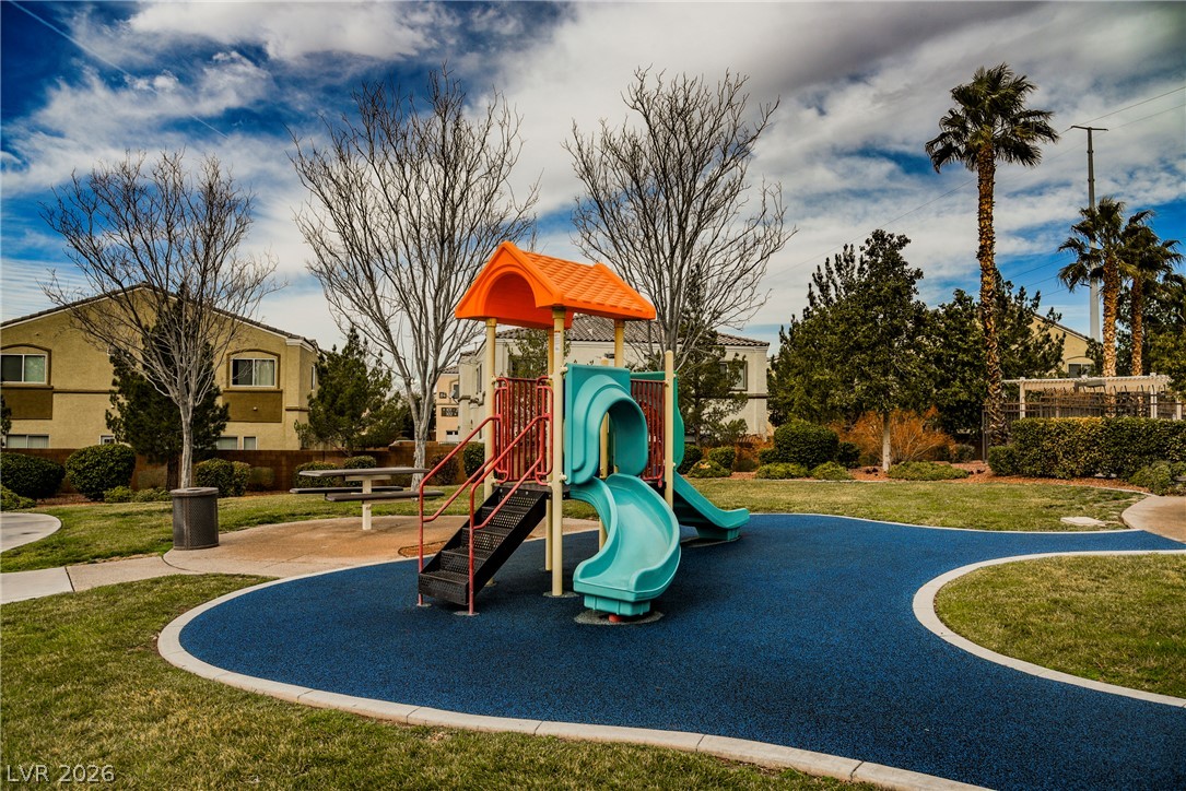 6320 Snap Ridge Street, Unit 201 North Las Vegas, NV 89081 - Photo 44 of 56 A vibrant community playground features a resilient surface for safe play.