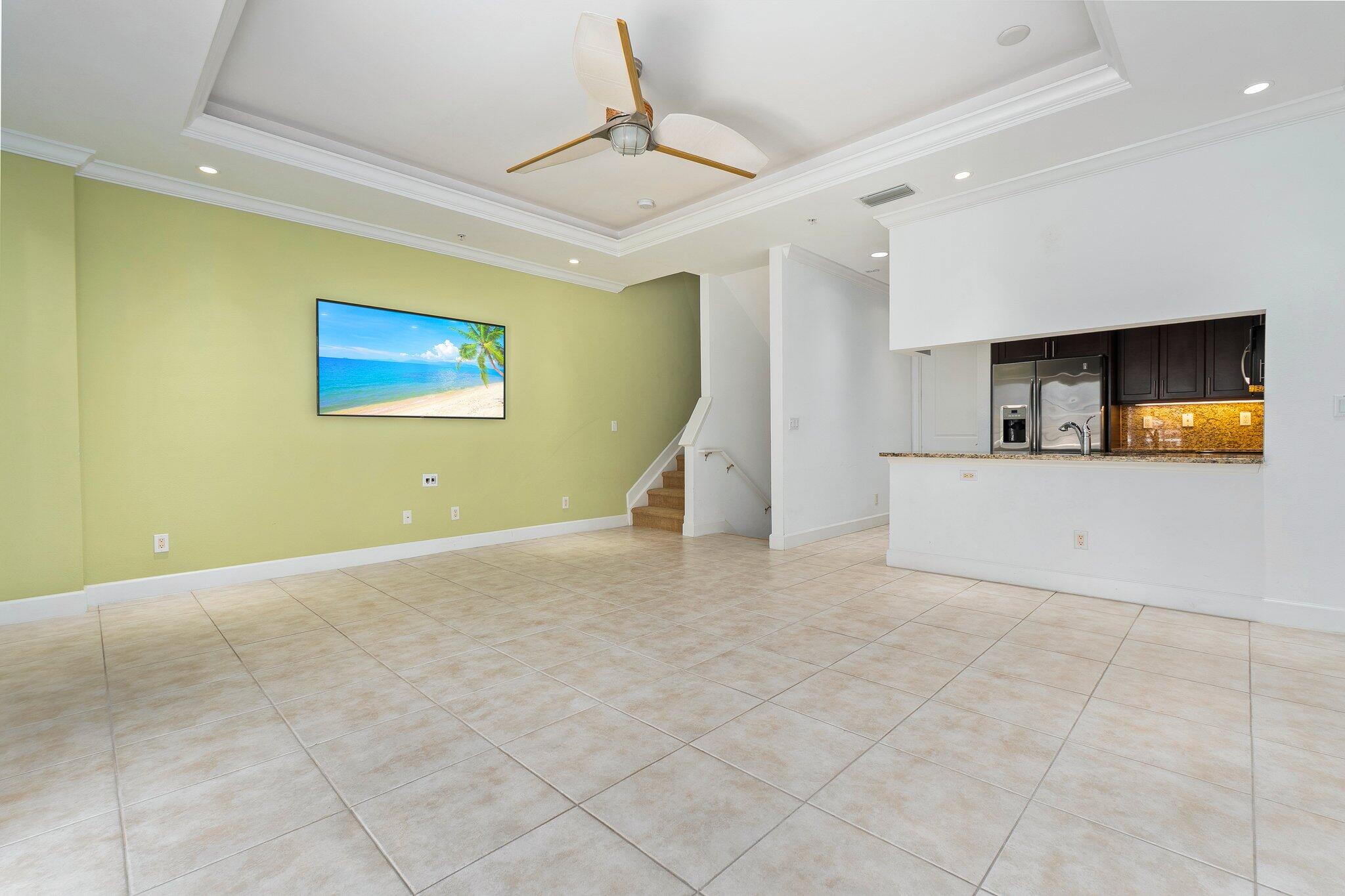 1579 Bow Line Road Fort Pierce, FL 34949 - Photo 14 of 56 a view of a livingroom with furniture and a ceiling fan