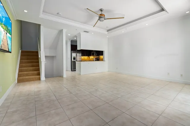 a kitchen with stainless steel appliances granite countertop a sink stove and microwave