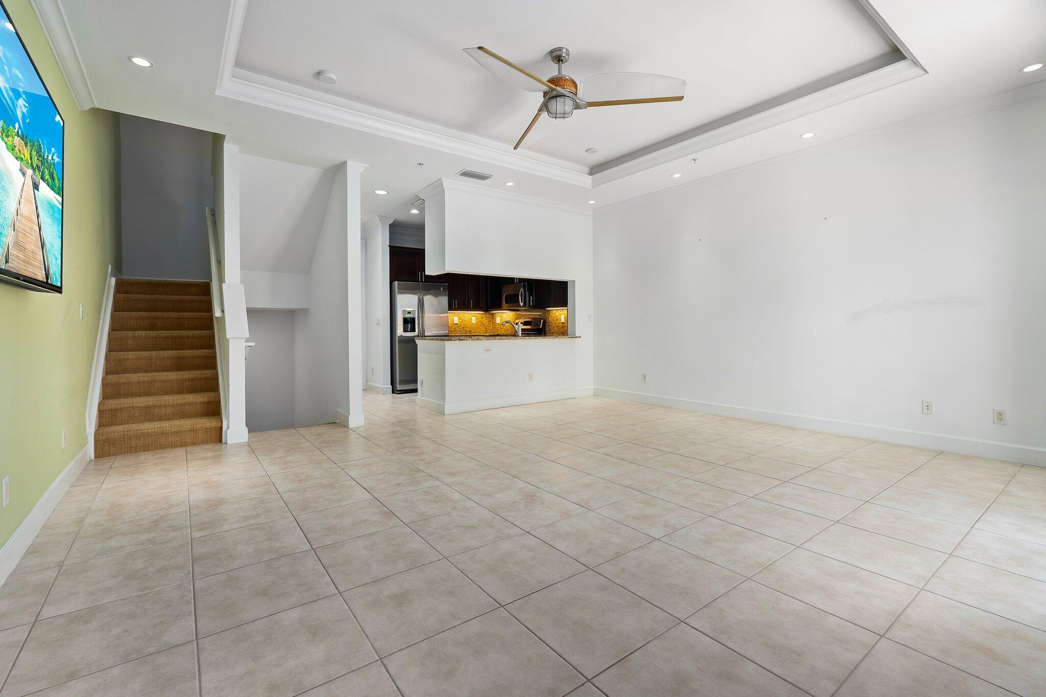 1579 Bow Line Road Fort Pierce, FL 34949 - Photo 16 of 56 a view of a livingroom with wooden floor and stairs