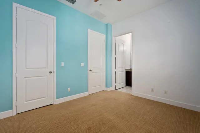 a view of a hallway with a room
