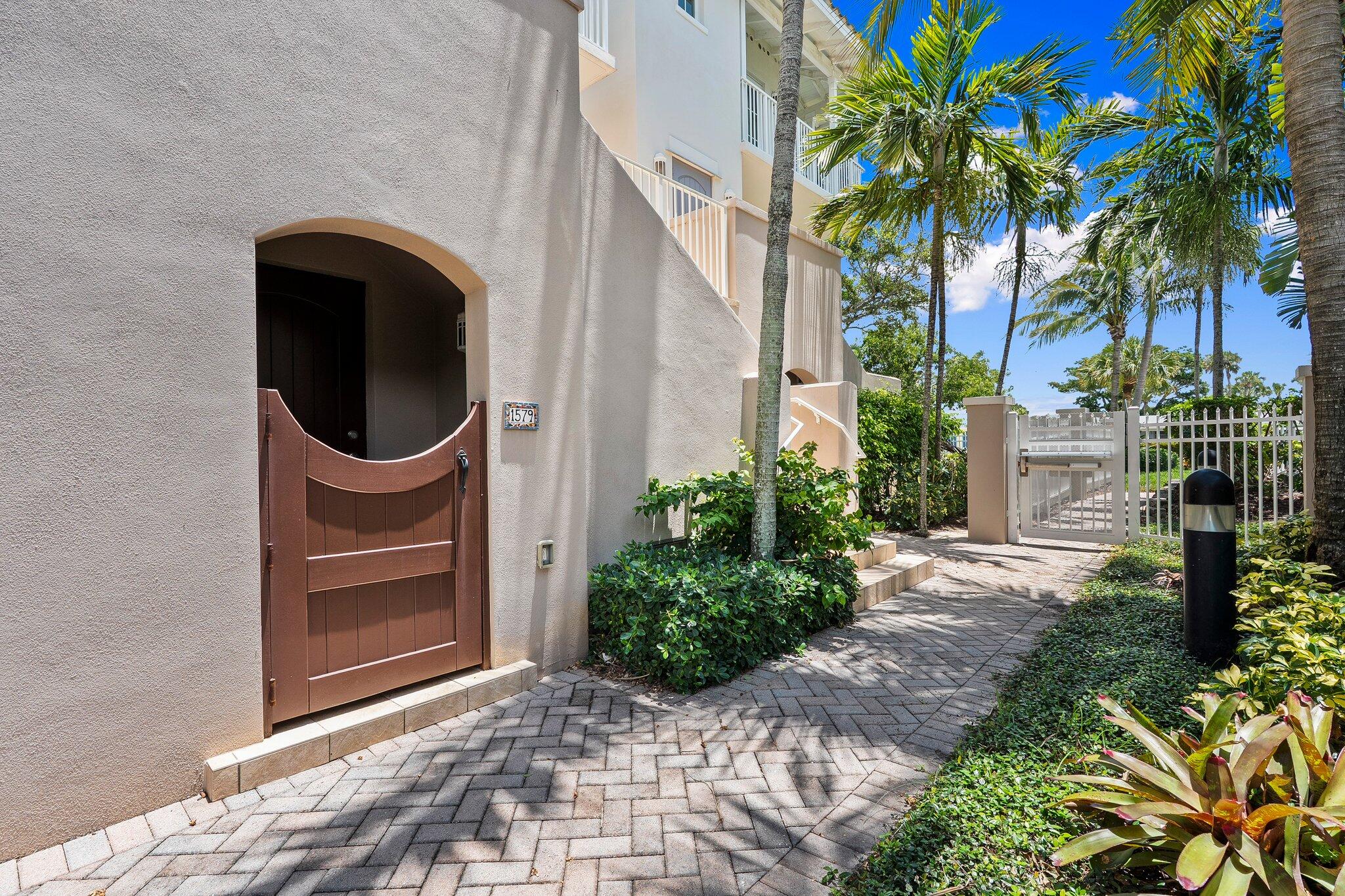 1579 Bow Line Road Fort Pierce, FL 34949 - Photo 4 of 56 a front view of a house with a garden