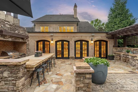 a view of a patio with swimming pool table and chairs