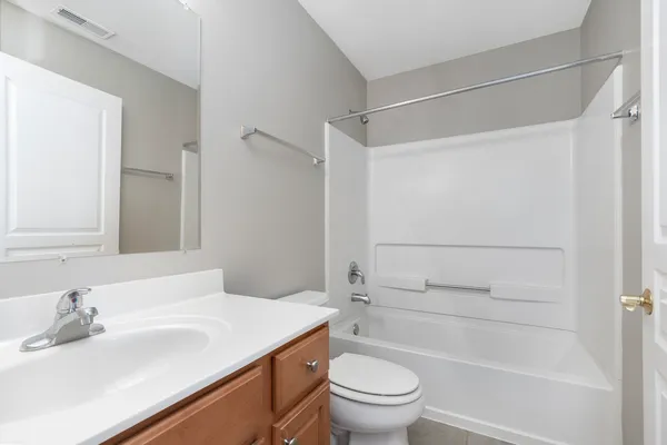 a bathroom with a sink a toilet and a bathtub
