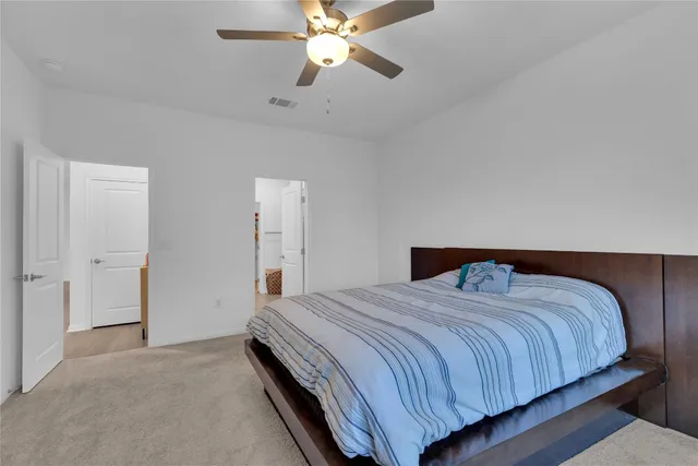 a bedroom with a bed and window