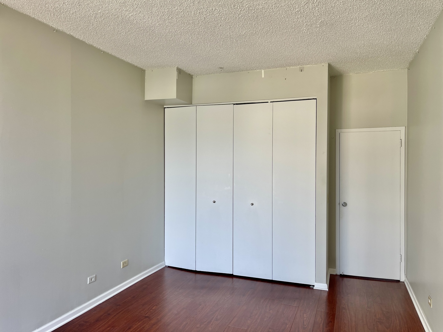 200 North Dearborn Street, Unit 4608 Chicago, IL 60601 - Photo 13 of 26 an empty room with wooden floor