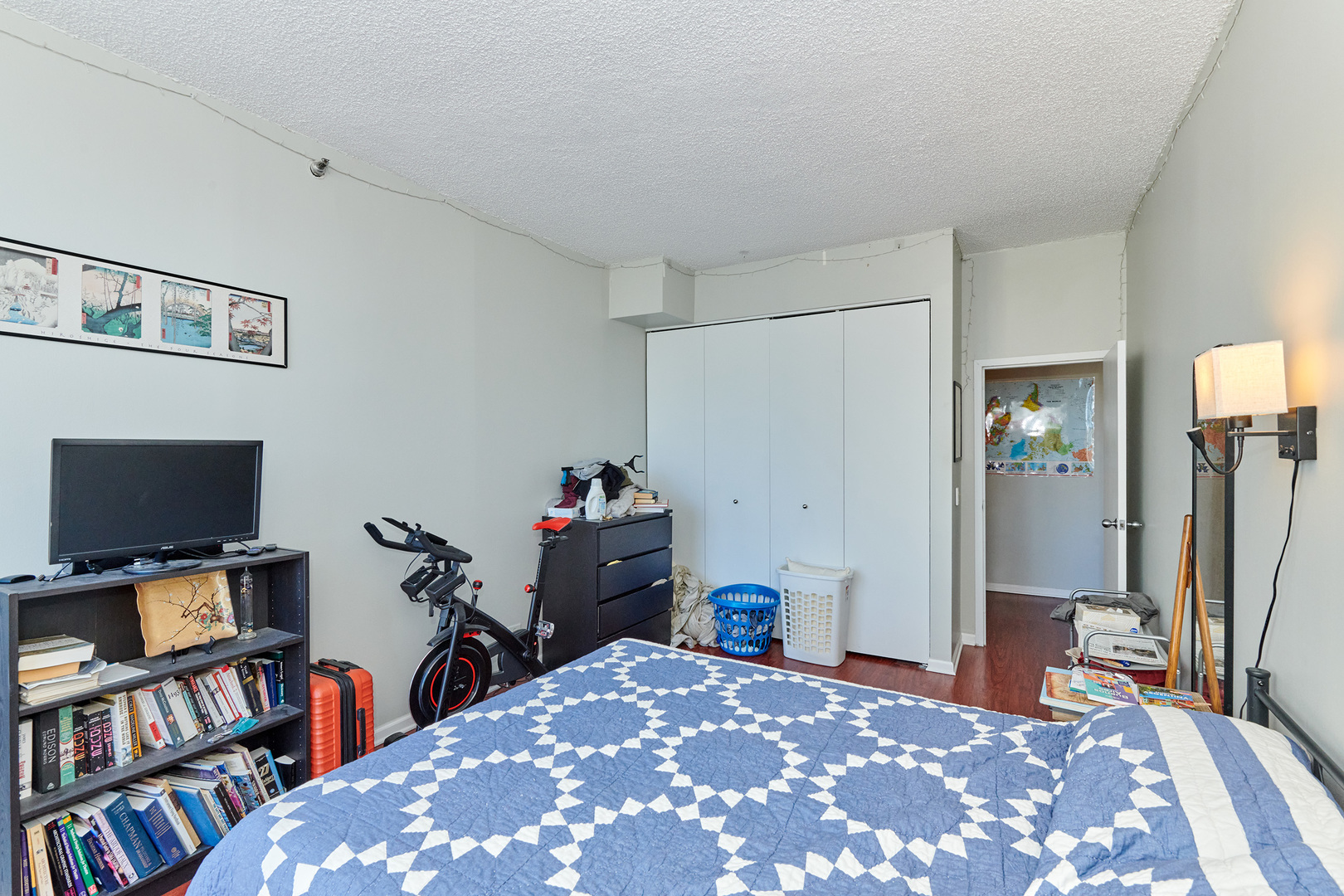200 North Dearborn Street, Unit 4608 Chicago, IL 60601 - Photo 16 of 26 a bedroom with a bed and a bookshelf