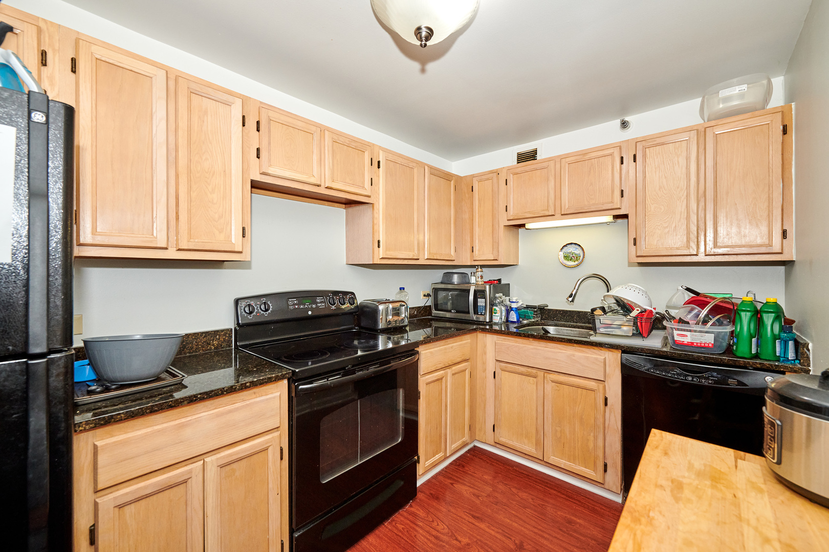 200 North Dearborn Street, Unit 4608 Chicago, IL 60601 - Photo 7 of 26 a kitchen with a sink stove and cabinets