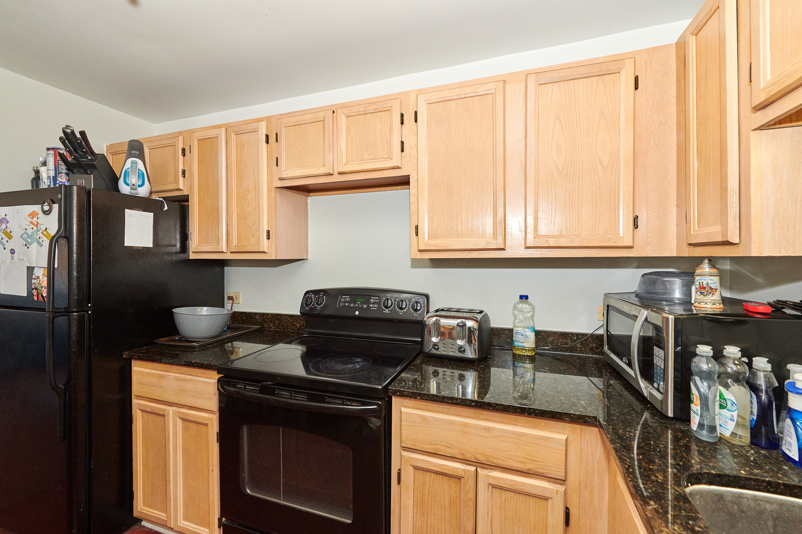 200 North Dearborn Street, Unit 4608 Chicago, IL 60601 - Photo 8 of 26 a kitchen with stainless steel appliances granite countertop a stove a sink and a microwave