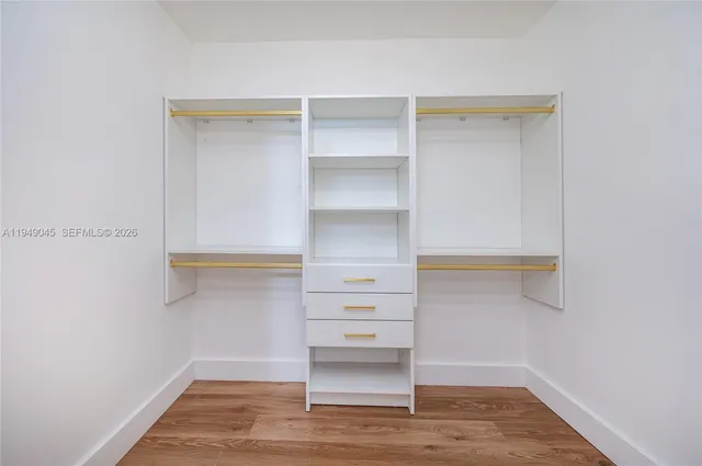 a view of an empty walk in closet