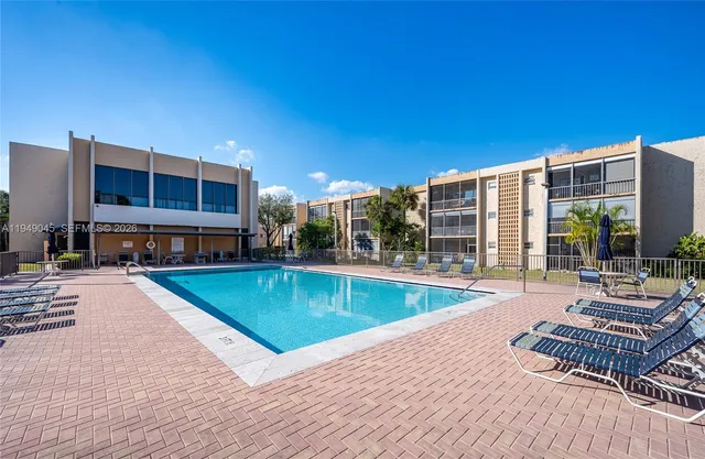 a living room with lots of furniture and white walls