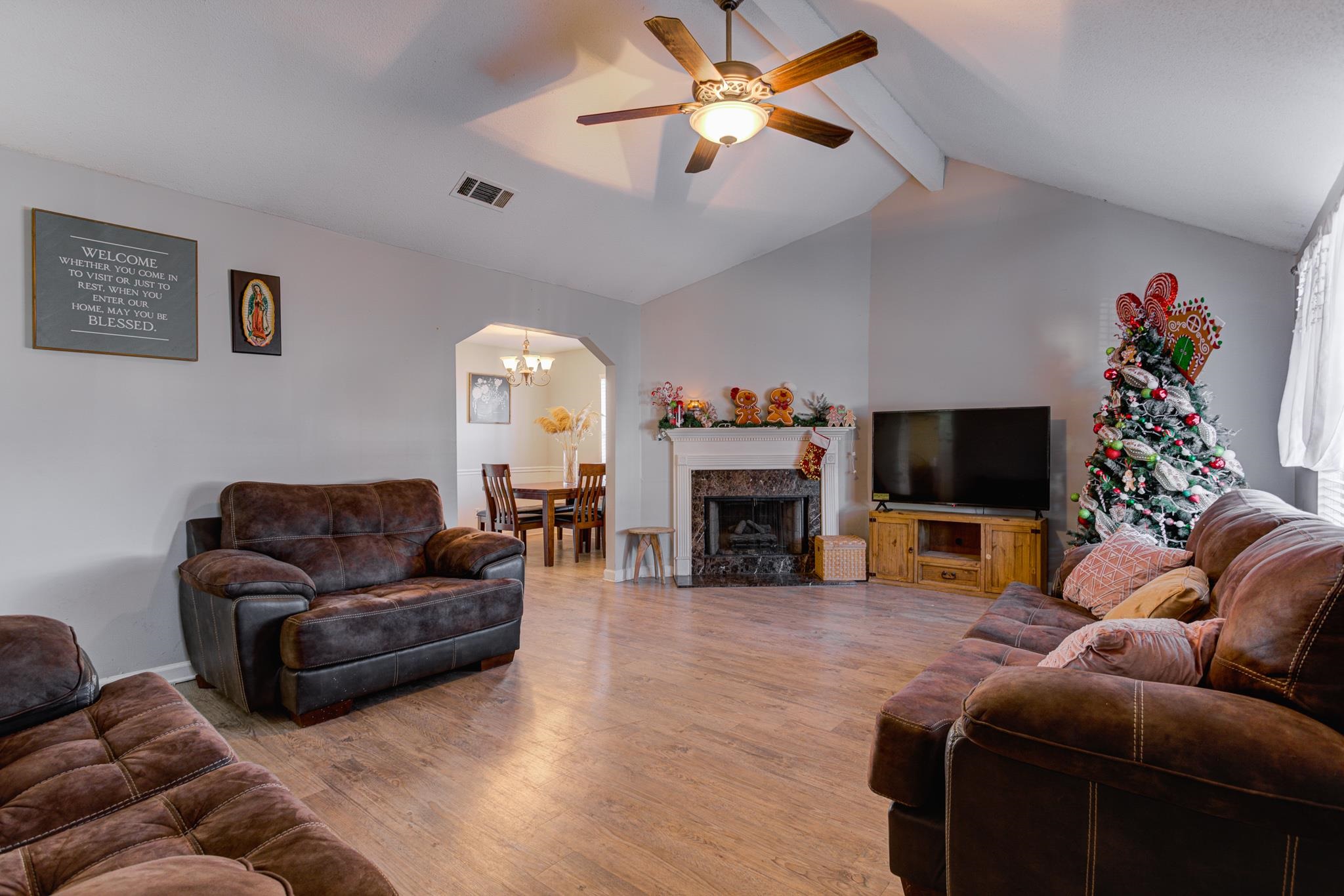 1673 Ranmar Drive Memphis, TN 38016 - Photo 3 of 16 a living room with furniture a fireplace and a flat screen tv
