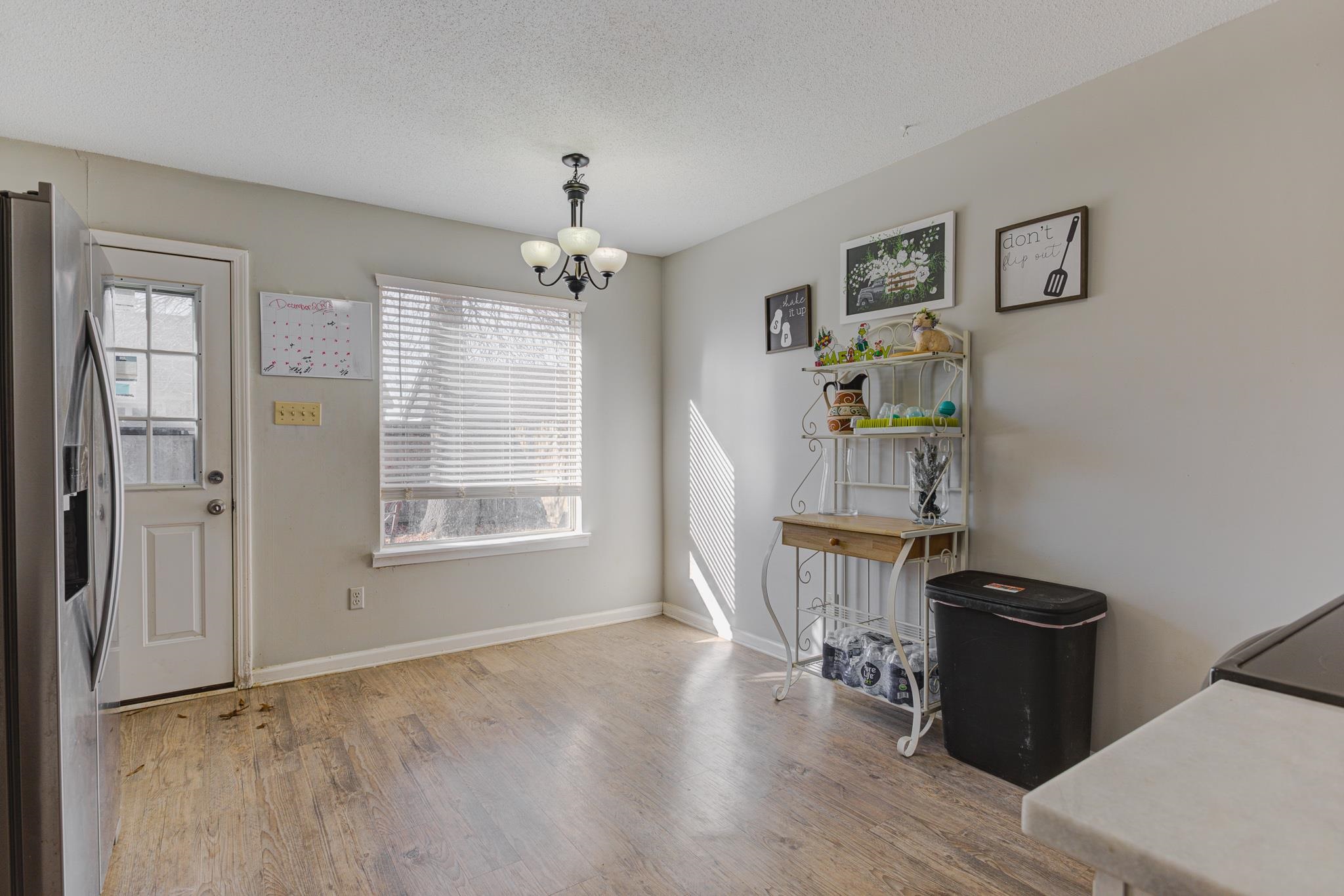 1673 Ranmar Drive Memphis, TN 38016 - Photo 7 of 16 a view of workspace with wooden floor and ceiling fan