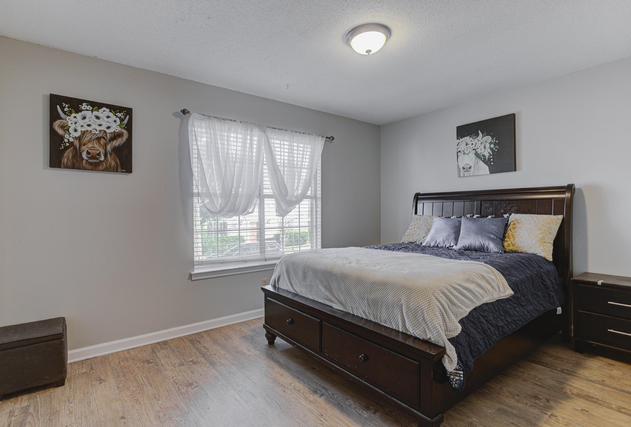 1673 Ranmar Drive Memphis, TN 38016 - Photo 9 of 16 a bed sitting in a bedroom next to a window