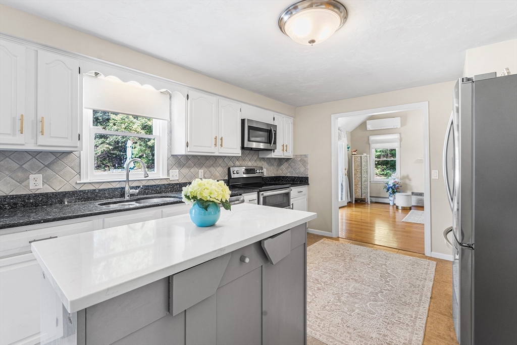 1 Jonathans Way Upton, MA 01568 - Photo 12 of 42 a kitchen with a refrigerator and a sink