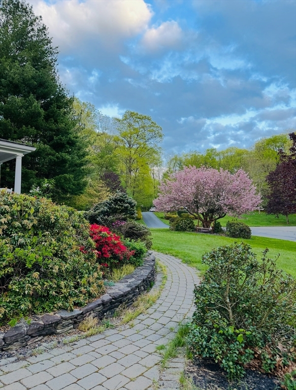 1 Jonathans Way Upton, MA 01568 - Photo 2 of 42 a view of a garden with a building in the background