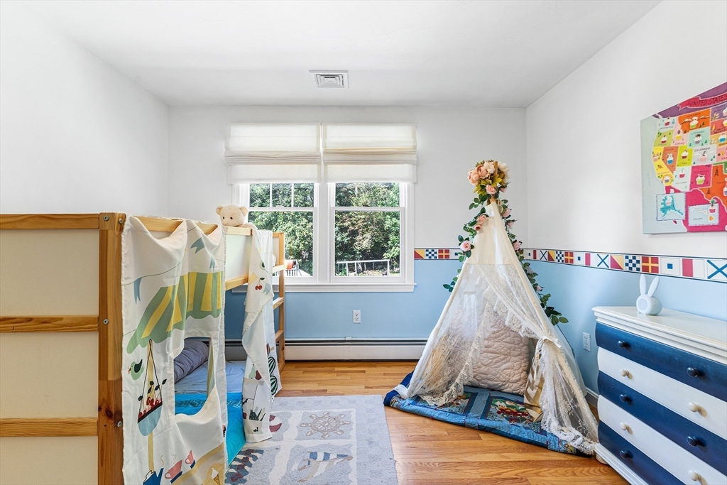 1 Jonathans Way Upton, MA 01568 - Photo 30 of 42 a living room with furniture and a floor to ceiling window