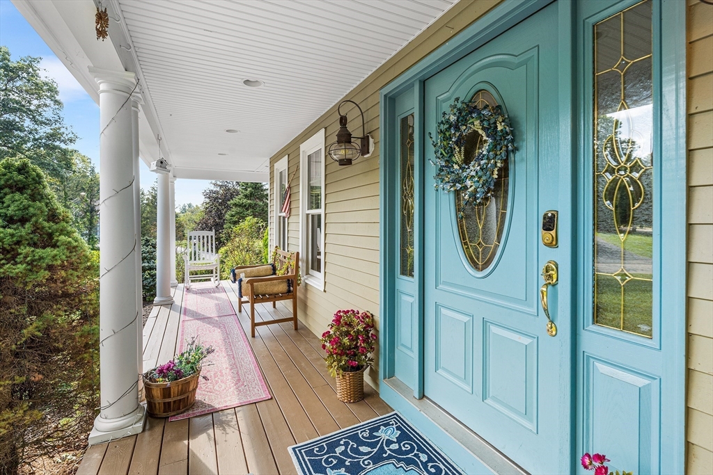 1 Jonathans Way Upton, MA 01568 - Photo 3 of 42 a view of a balcony with chairs and potted plants