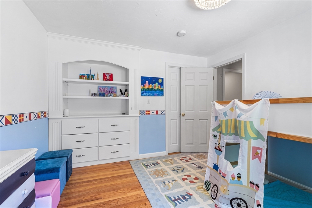 1 Jonathans Way Upton, MA 01568 - Photo 31 of 42 a bedroom with a bed and wooden floor