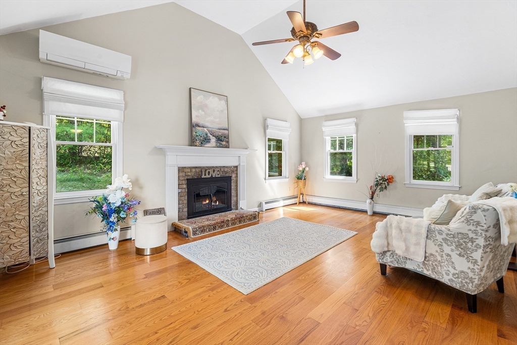 1 Jonathans Way Upton, MA 01568 - Photo 6 of 42 a living room with furniture and a fireplace