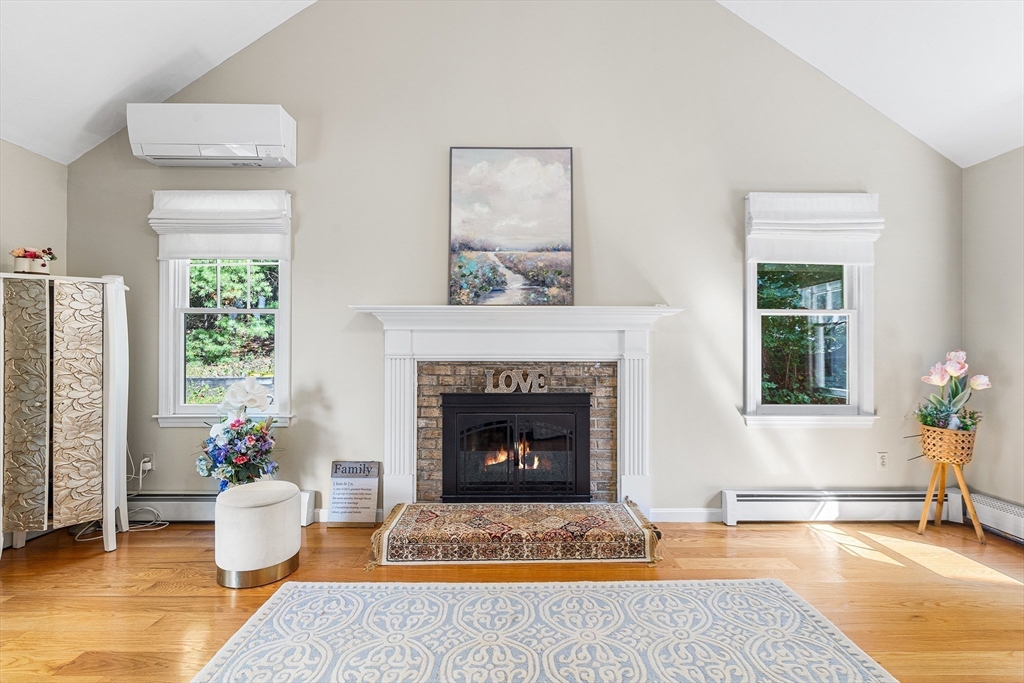 1 Jonathans Way Upton, MA 01568 - Photo 7 of 42 a living room with furniture and a fireplace