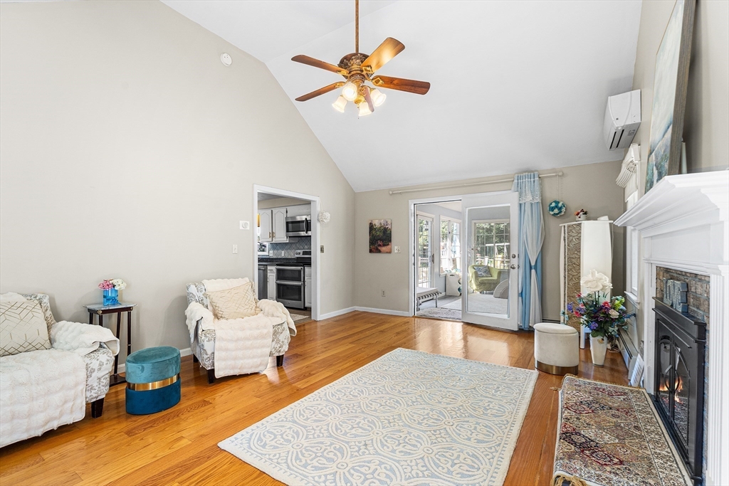 1 Jonathans Way Upton, MA 01568 - Photo 8 of 42 a living room with furniture fireplace and a rug