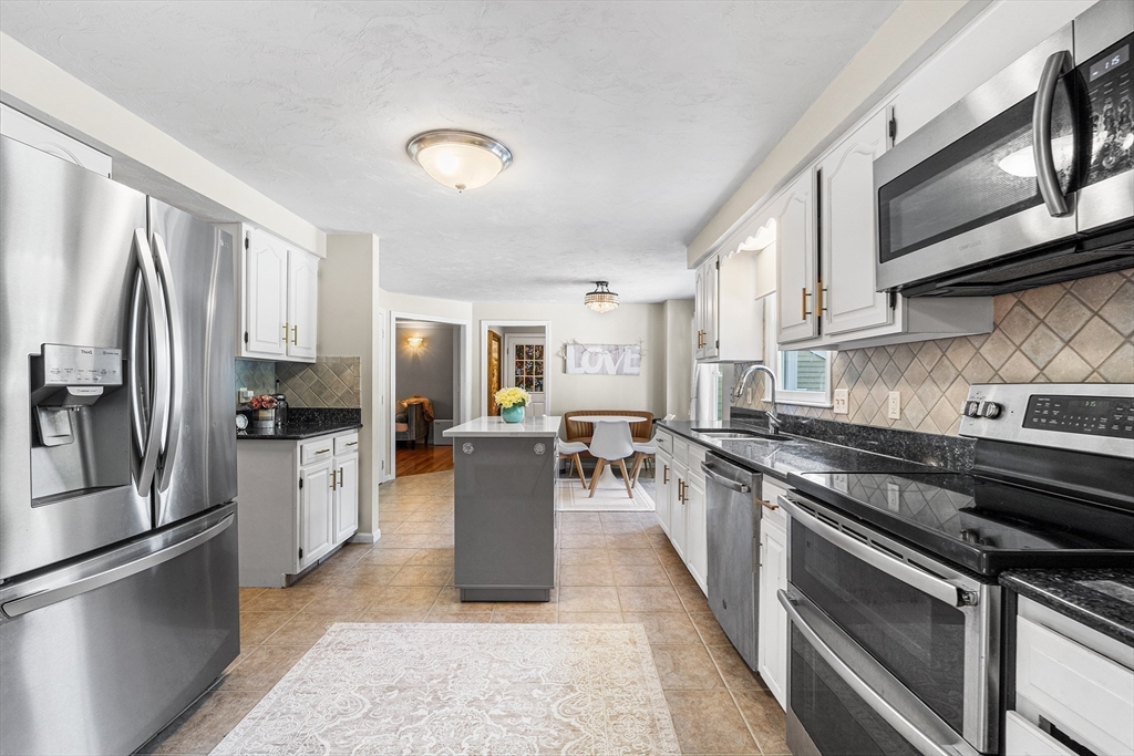 1 Jonathans Way Upton, MA 01568 - Photo 9 of 42 a kitchen with stainless steel appliances granite countertop a refrigerator stove microwave and sink