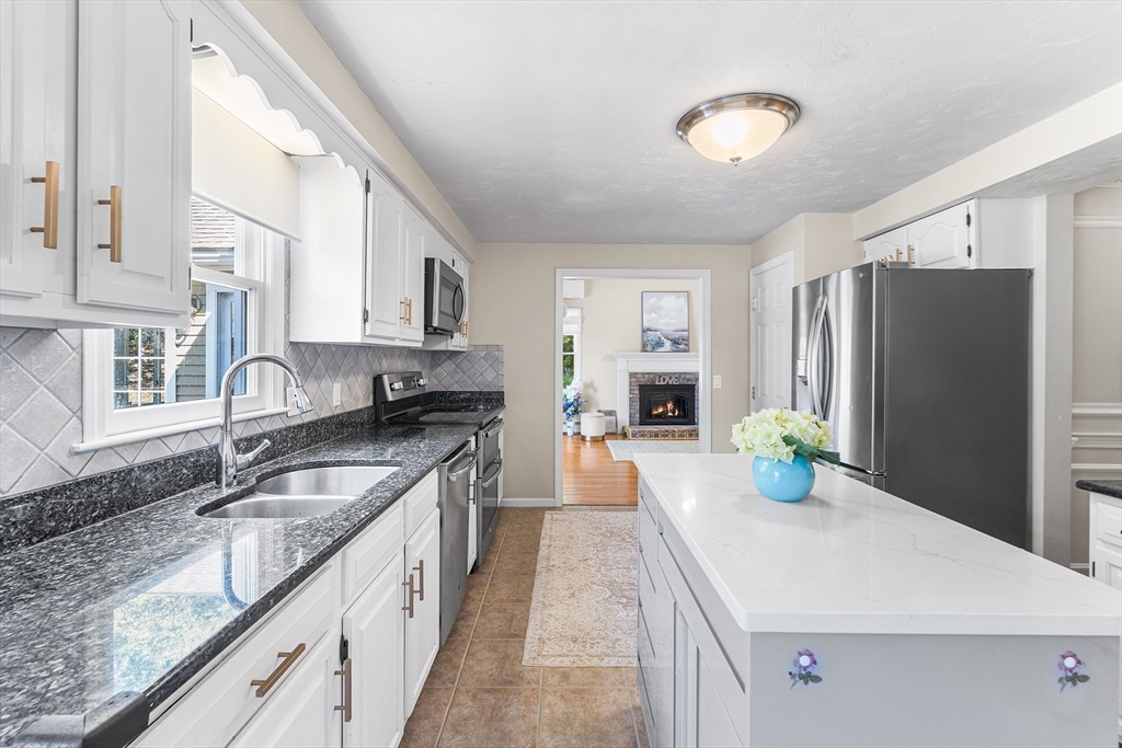 1 Jonathans Way Upton, MA 01568 - Photo 10 of 42 a kitchen with stainless steel appliances granite countertop a sink stove and refrigerator