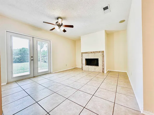 a view of an empty room with glass door