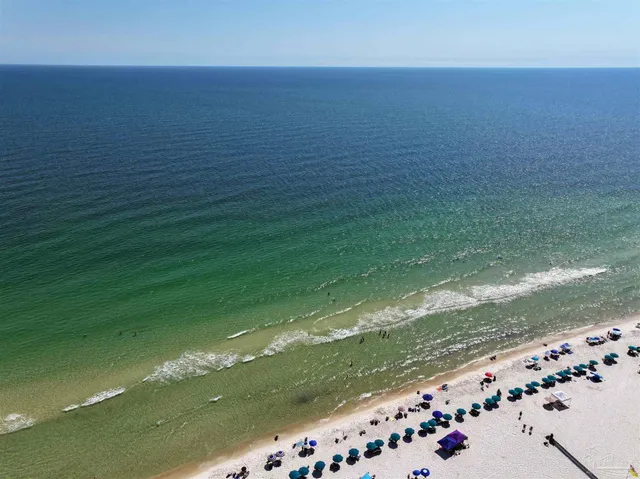 a hallway with wooden floor and entryway