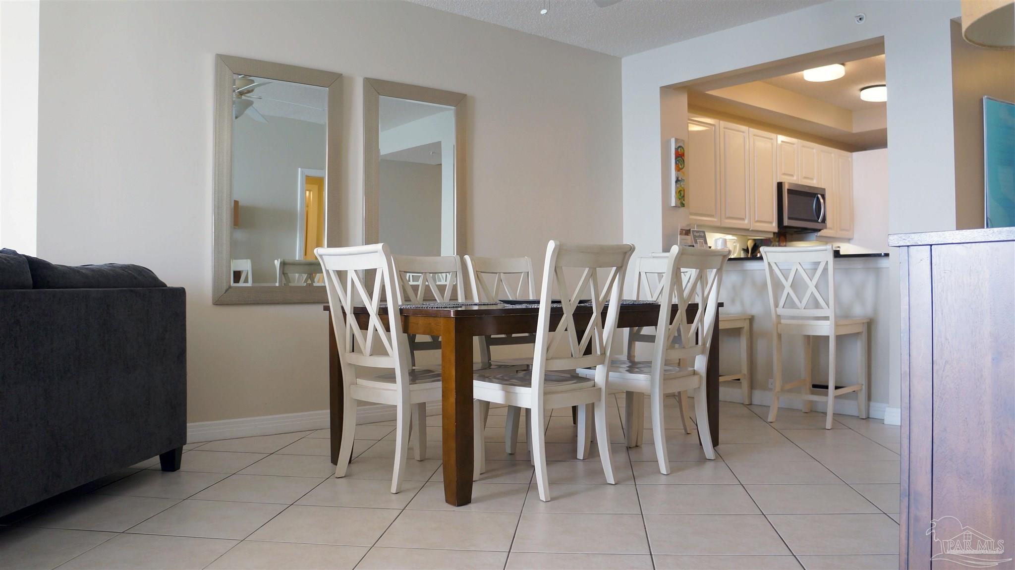 13597 Perdido Key Drive, Unit E12C Pensacola, FL 32507 - Photo 29 of 43 a view of a dining room with furniture