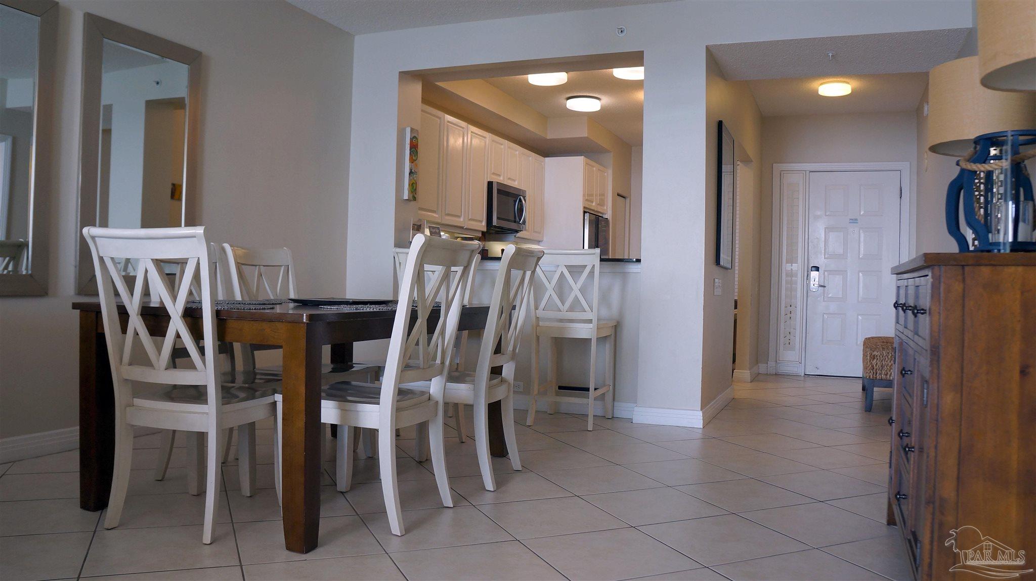 13597 Perdido Key Drive, Unit E12C Pensacola, FL 32507 - Photo 33 of 43 a view of a dining room with furniture