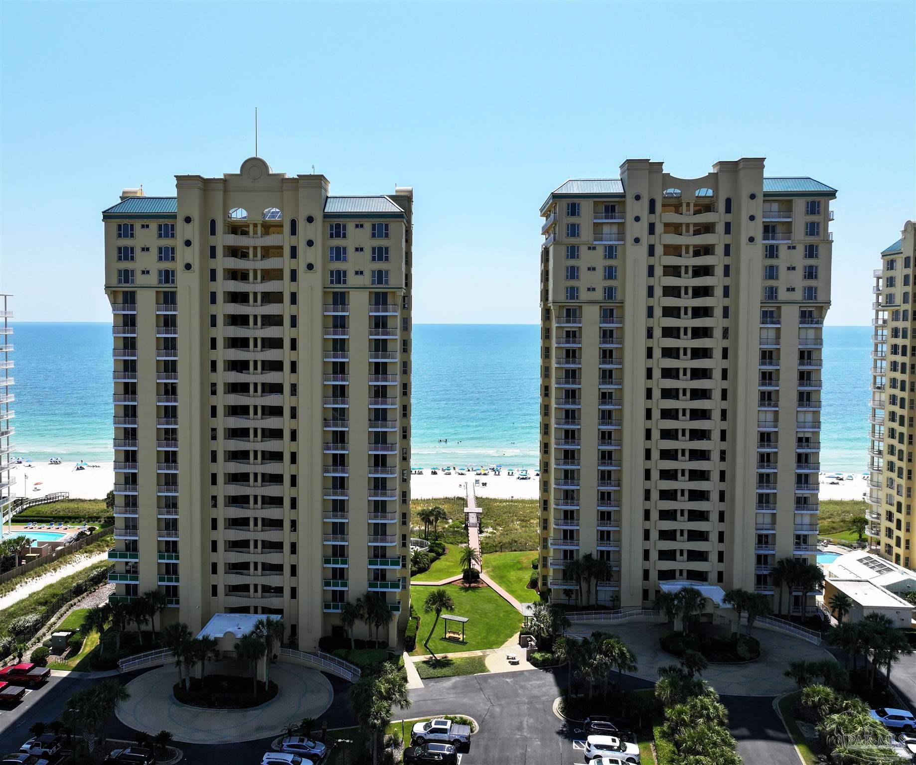 13597 Perdido Key Drive, Unit E12C Pensacola, FL 32507 - Photo 5 of 43 a view of a building with a street