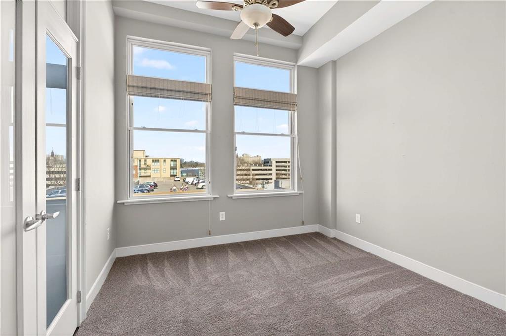 201 West Ponce De Leon Avenue, Unit 702 Decatur, GA 30030 - Photo 14 of 41 an empty room with a window