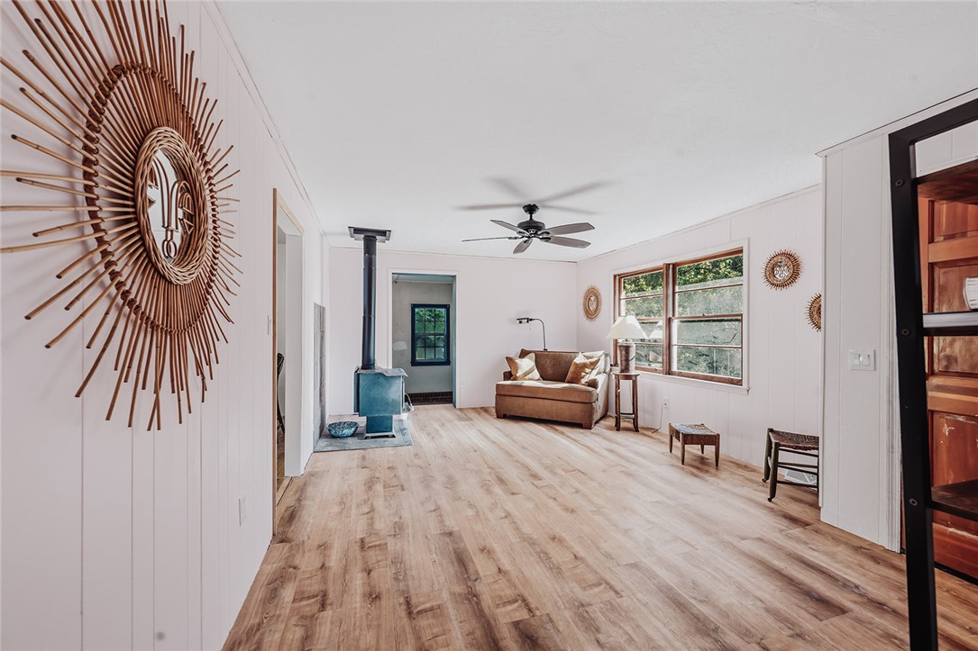 209 Cleveland Pike Road Westminster, SC 29693 - Photo 13 of 30 A rustic hearth and light wood flooring define this inviting living space.