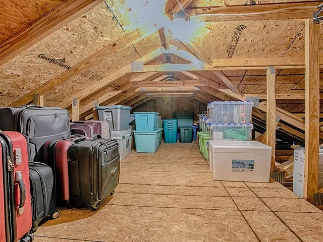 a view of a patio with table and chairs