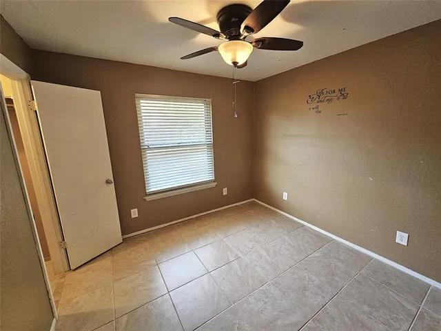 a bathroom with a sink toilet vanity and shower