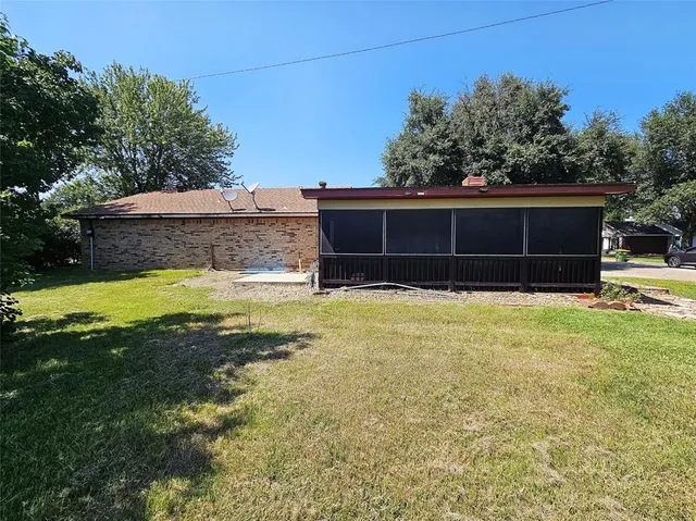 a view of a house with pool and a yard