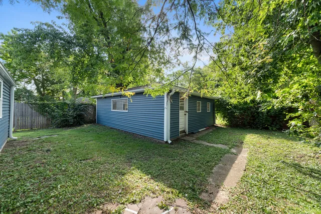a view of a back yard of the house