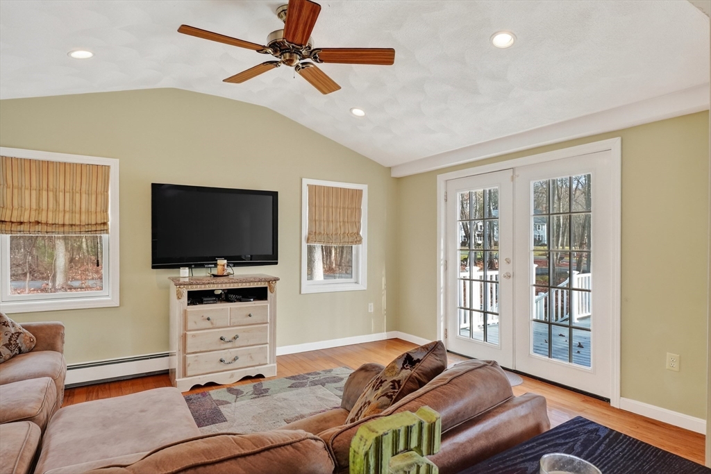 21 Fairbanks Road Chelmsford, MA 01824 - Photo 13 of 29 a living room with furniture and a flat screen tv
