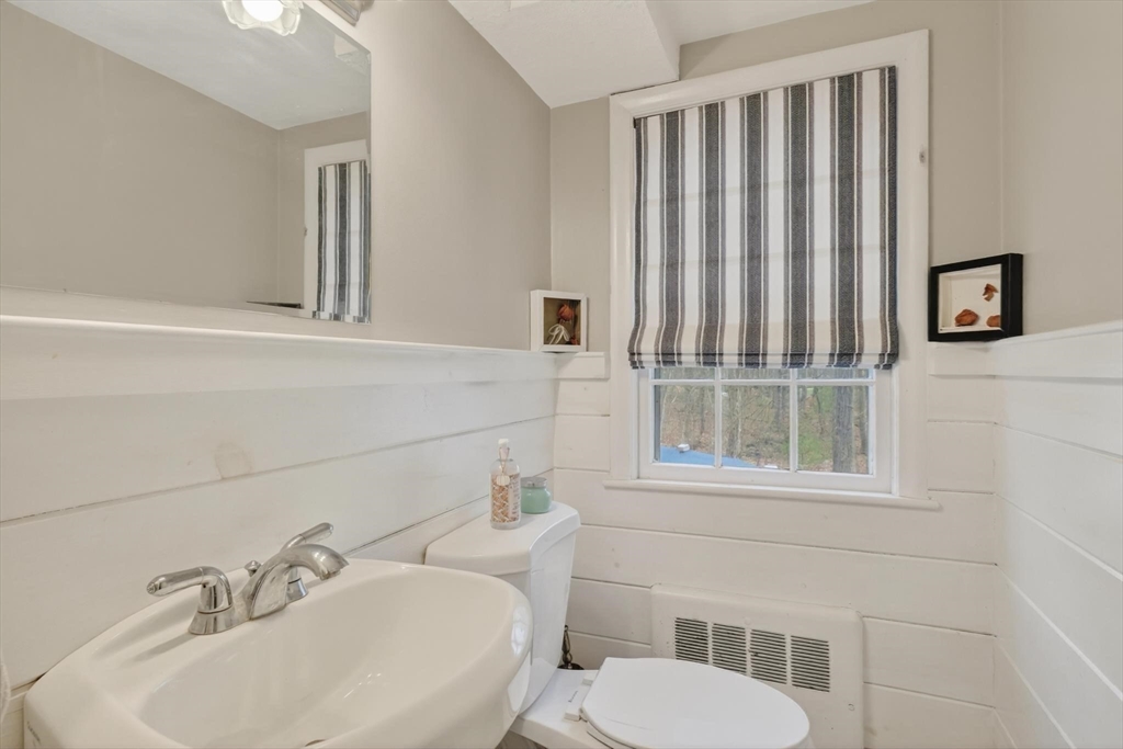 21 Fairbanks Road Chelmsford, MA 01824 - Photo 14 of 29 a bathroom with a sink a toilet and mirror